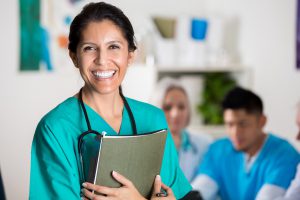 Confident doctor in medical staff meeting